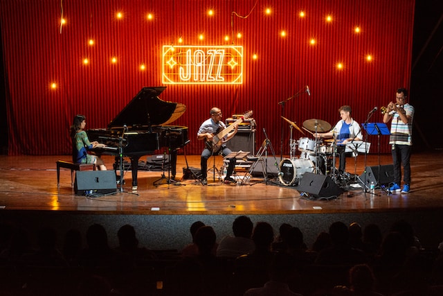 Ensemble of Jazz musicians performing on stage
